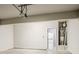 Garage featuring a water heater and access to the interior of the house at 3045 Flat Shoals Rd, Atlanta, GA 30349