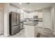 Spacious kitchen featuring stainless steel appliances, white cabinets, and gray countertops at 3045 Flat Shoals Rd, Atlanta, GA 30349