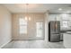 Bright kitchen dining area with stainless steel appliances and a door leading to the backyard at 3045 Flat Shoals Rd, Atlanta, GA 30349