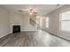 Bright, open-concept living room featuring modern flooring and a classic fireplace at 3045 Flat Shoals Rd, Atlanta, GA 30349