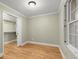 Bedroom with hardwood floors and closet with sliding doors at 3630 Lake Se Dr, Smyrna, GA 30082