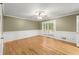 Dining room with hardwood floors, wainscoting, and access to deck at 3630 Lake Se Dr, Smyrna, GA 30082