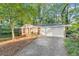 Brick ranch house with attached garage and mature trees at 3630 Lake Se Dr, Smyrna, GA 30082