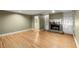 Living room with hardwood floors, fireplace, and built-in shelving at 3630 Lake Se Dr, Smyrna, GA 30082