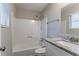 Updated bathroom with granite countertop, bathtub, and shower at 1832 Vauxhall Dr, Lithonia, GA 30058