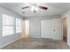 Primary bedroom with double closets and ceiling fan at 1832 Vauxhall Dr, Lithonia, GA 30058