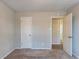 Bedroom with closet and access to hallway at 1832 Vauxhall Dr, Lithonia, GA 30058