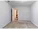 Bright bedroom with door to bathroom and neutral walls at 1832 Vauxhall Dr, Lithonia, GA 30058