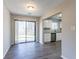 Bright dining room with hardwood floors and a view of the backyard through sliding doors at 1832 Vauxhall Dr, Lithonia, GA 30058