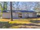 Rear view of house, showcasing the patio and yard at 1832 Vauxhall Dr, Lithonia, GA 30058