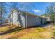 Rear view of house showing patio and yard at 1832 Vauxhall Dr, Lithonia, GA 30058