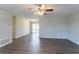 Spacious living area with hardwood floors, a ceiling fan, and sliding glass doors to patio at 1832 Vauxhall Dr, Lithonia, GA 30058