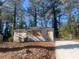 Newly renovated house with driveway, surrounded by trees at 1901 Oak Valley Rd, Decatur, GA 30035