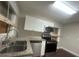 Modern kitchen with granite countertops and stainless steel appliances at 1901 Oak Valley Rd, Decatur, GA 30035