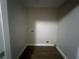 Small laundry room with vinyl flooring and hookups at 1901 Oak Valley Rd, Decatur, GA 30035