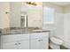 Updated bathroom with granite countertop and white cabinets at 4509 Central Dr, Stone Mountain, GA 30083