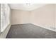 Bright bedroom with neutral walls and gray carpeting at 4509 Central Dr, Stone Mountain, GA 30083