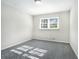 Well-lit bedroom with gray carpeting and a large window at 4509 Central Dr, Stone Mountain, GA 30083
