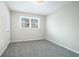 Spacious bedroom with gray carpeting and large windows at 4509 Central Dr, Stone Mountain, GA 30083