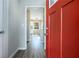 Bright entryway with red front door and view into the living area at 4509 Central Dr, Stone Mountain, GA 30083