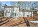 Rear view of a ranch house with a patio and yard at 4509 Central Dr, Stone Mountain, GA 30083