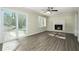 Living room with fireplace, hardwood floors and sliding glass doors at 4509 Central Dr, Stone Mountain, GA 30083