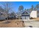 Gray two-story house with a two-car garage and landscaped yard at 6859 Winding Wade Trl, Austell, GA 30168