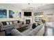 Living room with gray sofas, fireplace and large windows at 6859 Winding Wade Trl, Austell, GA 30168