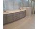 Double vanity bathroom with gray cabinets and tile flooring at 1999 Gladys Ct, Marietta, GA 30064