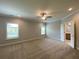 Large bedroom with plush carpeting, ceiling fan, and ample natural light at 1999 Gladys Ct, Marietta, GA 30064