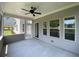 Relaxing screened porch with ceiling fan and view of backyard at 1999 Gladys Ct, Marietta, GA 30064