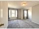 Bedroom featuring carpet flooring, neutral paint and window views at 1999 Riverlanding Cir, Lawrenceville, GA 30046