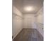 Walk-in closet with carpet flooring, shelves, and white walls at 1999 Riverlanding Cir, Lawrenceville, GA 30046