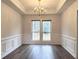 Elegant dining room with decorative molding, chandelier, and plenty of natural light at 1999 Riverlanding Cir, Lawrenceville, GA 30046