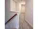 A hallway with carpet flooring and neutral paint at 1999 Riverlanding Cir, Lawrenceville, GA 30046