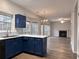 Bright kitchen with stylish cabinetry and modern finishes that opens to the Gathering room at 1999 Riverlanding Cir, Lawrenceville, GA 30046