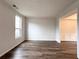 Bright living room with wood-look floors and ample natural light from a large window at 1999 Riverlanding Cir, Lawrenceville, GA 30046