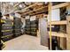 Unfinished basement area with shelving and storage at 925 Upper Hembree Rd, Roswell, GA 30076