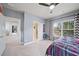 Bedroom with gray walls, ceiling fan, and access to other rooms at 925 Upper Hembree Rd, Roswell, GA 30076