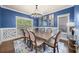 Elegant dining room with blue walls and a statement chandelier at 925 Upper Hembree Rd, Roswell, GA 30076