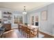 Bright dining room with farmhouse table and access to backyard patio at 925 Upper Hembree Rd, Roswell, GA 30076