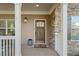 Inviting front door entrance with stone and wood accents at 925 Upper Hembree Rd, Roswell, GA 30076