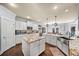 Open kitchen featuring granite countertops, stainless steel appliances, and an island at 925 Upper Hembree Rd, Roswell, GA 30076