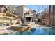 Luxury pool and spa with outdoor entertainment area at 925 Upper Hembree Rd, Roswell, GA 30076