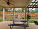 Covered patio overlooking a tiered backyard with garden at 965 Mulberry Bay Dr, Dacula, GA 30019