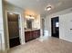 Bathroom with vanity, granite countertop and access to closet at 965 Mulberry Bay Dr, Dacula, GA 30019