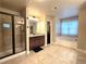 Spa-like bathroom with soaking tub, walk-in shower, and double vanity at 965 Mulberry Bay Dr, Dacula, GA 30019