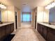 Large bathroom with double vanities, soaking tub, and shower at 965 Mulberry Bay Dr, Dacula, GA 30019