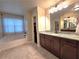 Bathroom with vanity, granite countertop and bathtub at 965 Mulberry Bay Dr, Dacula, GA 30019