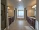 Large bathroom with double vanities, soaking tub, and separate shower at 965 Mulberry Bay Dr, Dacula, GA 30019